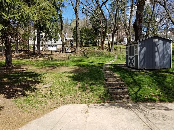Backyard, parking, and storage shed