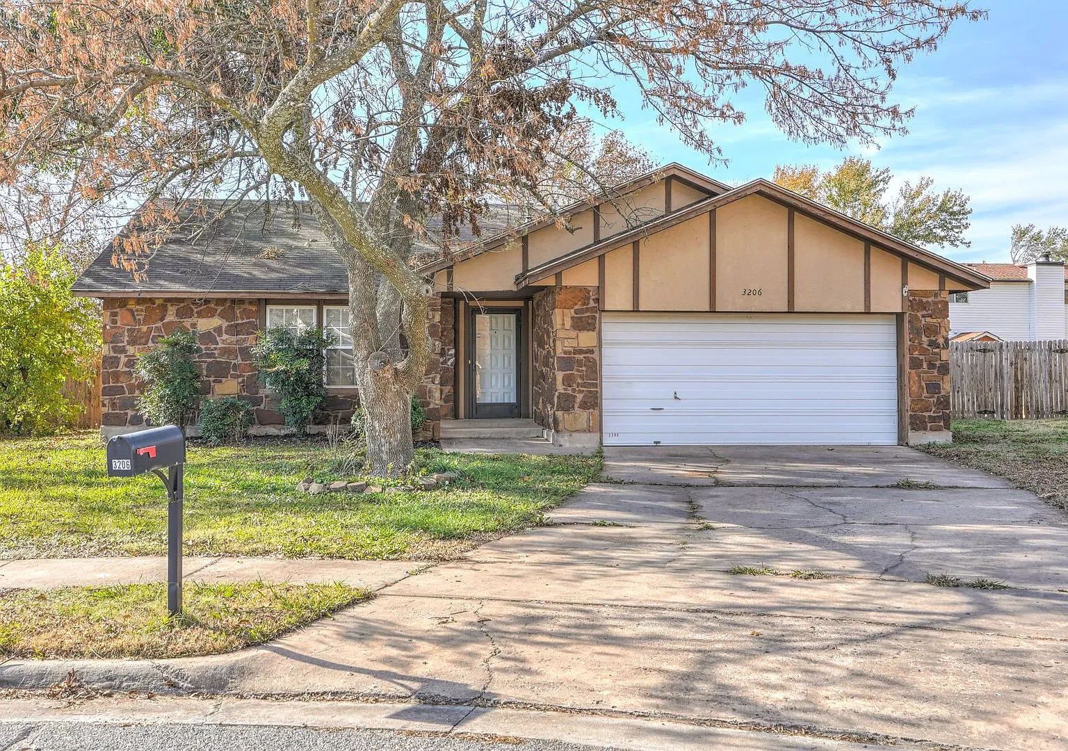 Tucked away at the back of a cul-de-sac on a large, tree-filled lot, this home offers plenty of s... — Photo 1