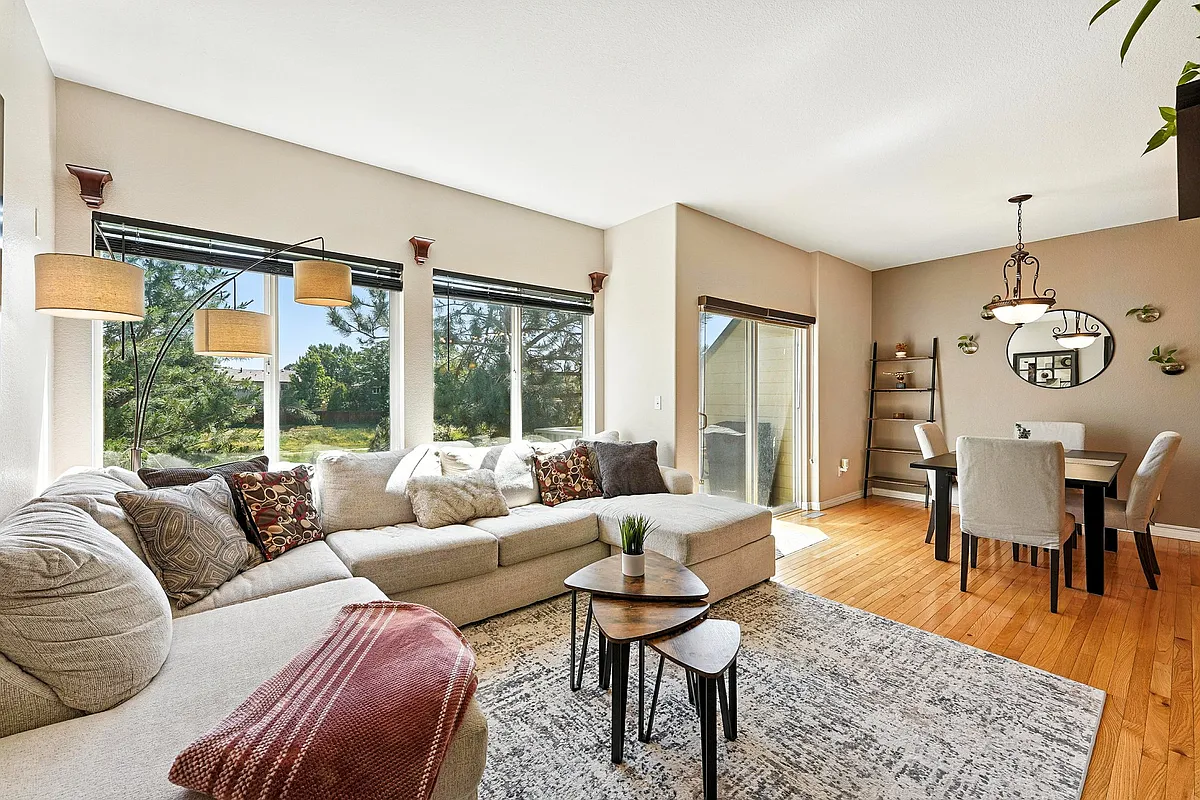 Comfortable main-level living space with easy access to private deck. - 1206 S Idalia St #B