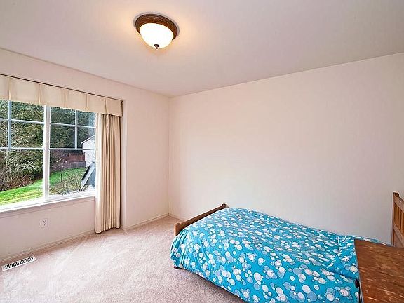 One of the three secondary bedrooms upstairs.