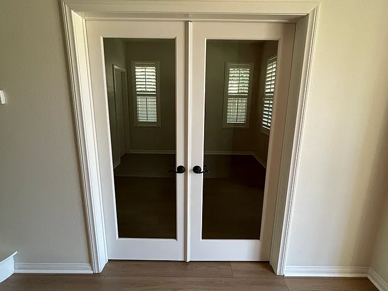 Double doors to the office on the main floor.