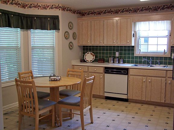 PLENTY OF SPACE IN THIS EAT-IN KITCHEN WITH UPDATED CABINETS