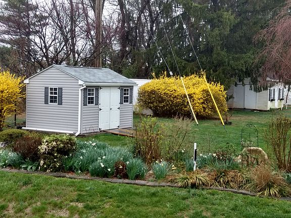 Storage shed and flower beds