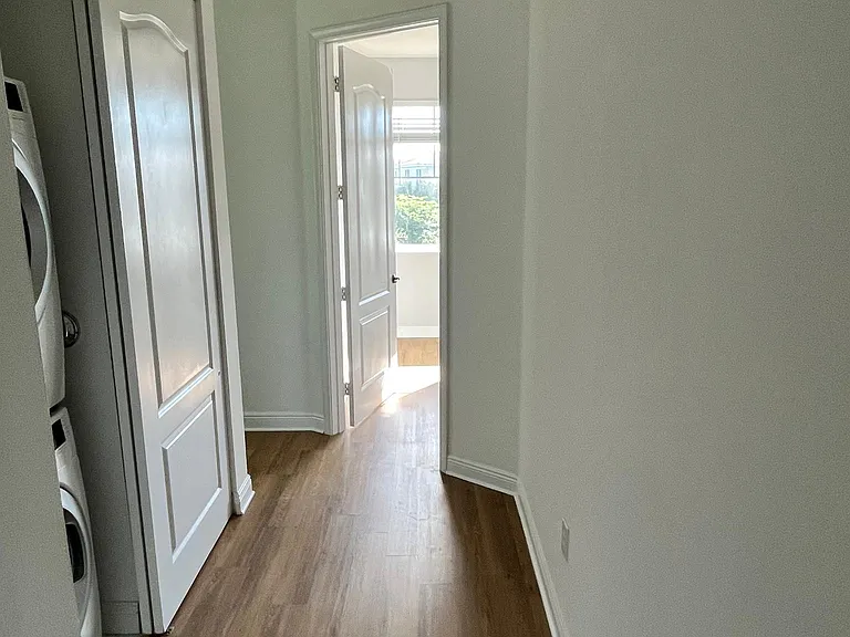 3rd floor hallway between bedroom 2 & 3. Washer & dryer