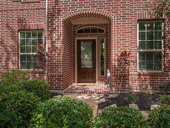 Lush, mature landscaping, solid wood door with etched glass inlay, shatter proof windows (no need for hurricane shutters!) and all 4 sides are brick on the first level of this home that has been meticulously maintained by the original owners.