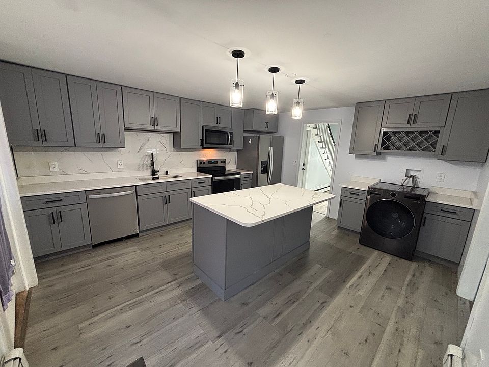Updated Kitchen with Granite Countertops and Stainless Steel Appliances
