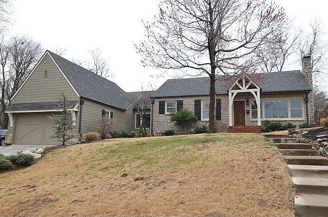 Picturesque stone and shake shingle home