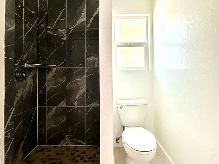 Bathroom with full tile shower