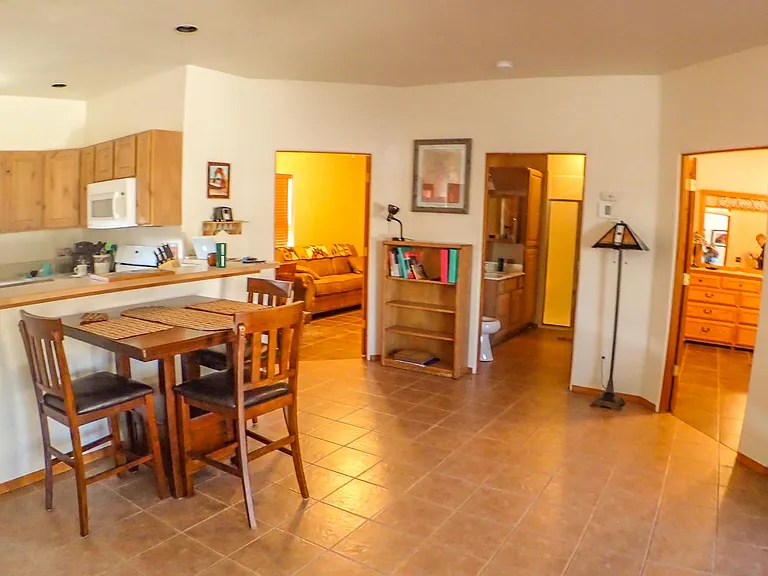 dining area and doors to bedrooms and bath