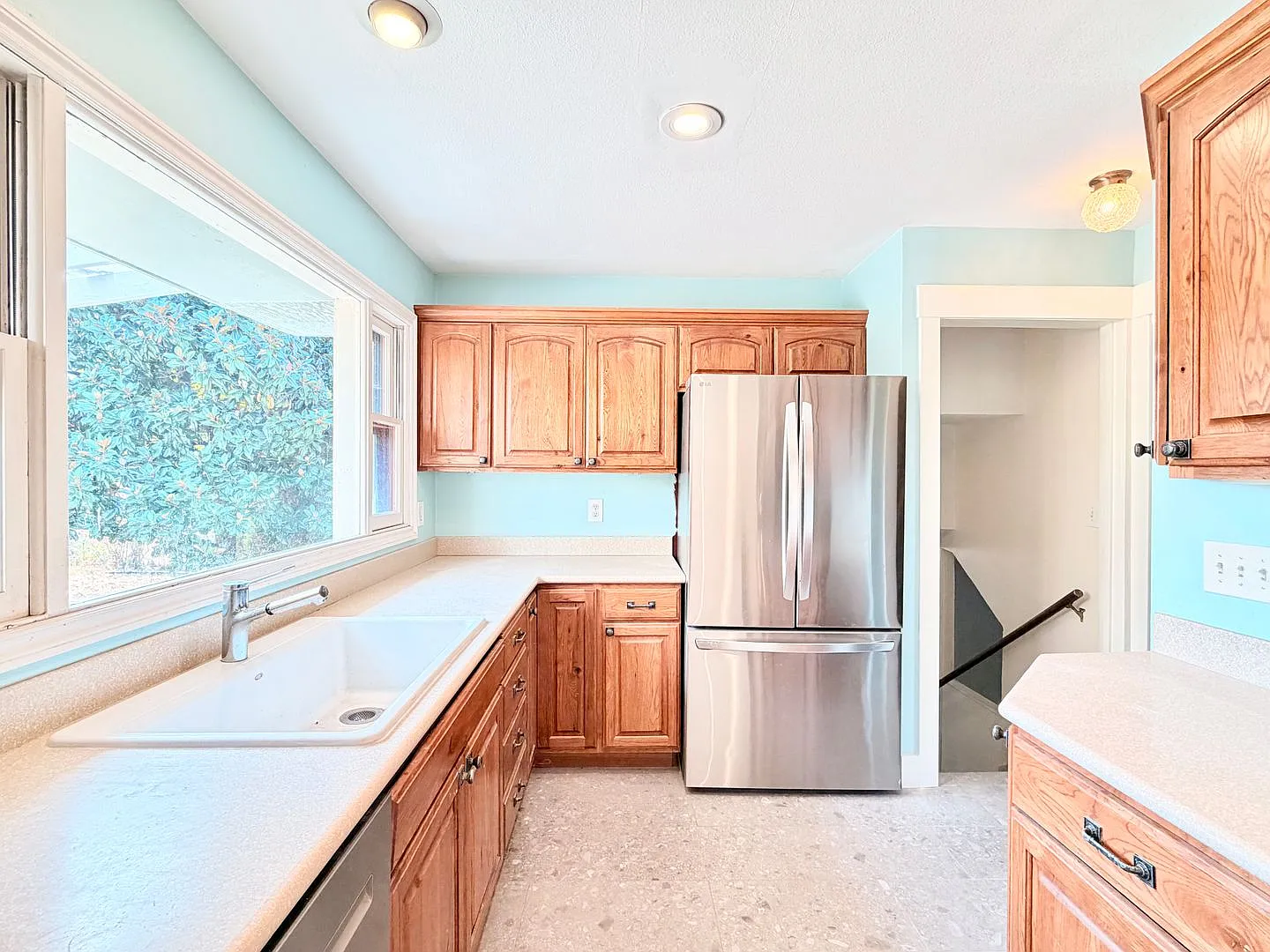 Charming Updated 1950s Home with Refinished Hardwoods & Large Fenced Yard Landscaping Included! — Photo 3