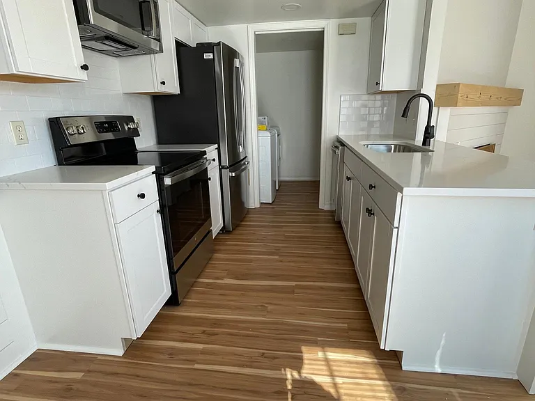 All new kitchen! New cabinets, new stainless steel appliances, new fixtures. New quartz countertops!