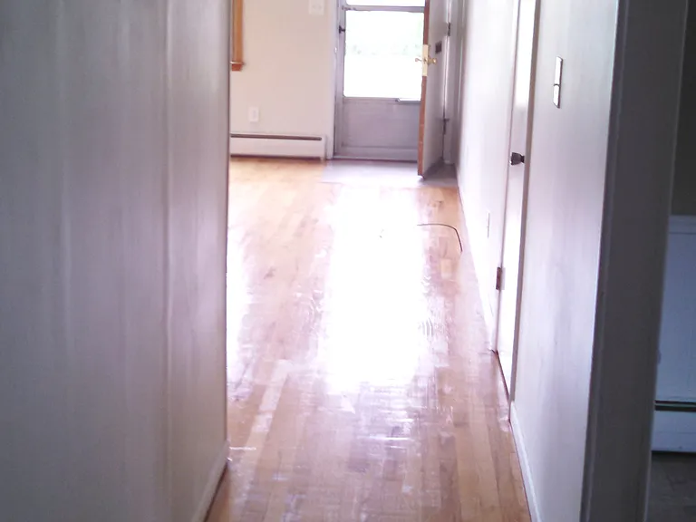 view of hallway to front door