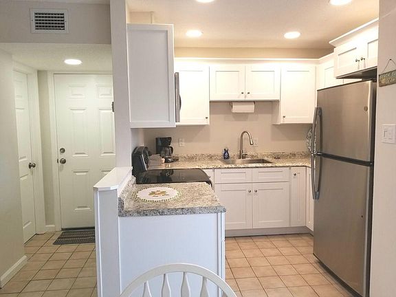 New kitchen with all pots, pans, dishes and flatware you may need.