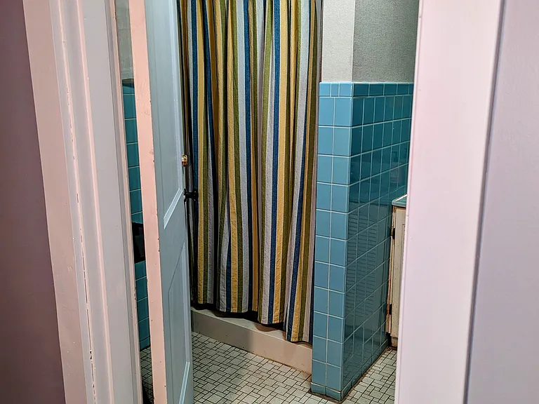 Private Bathroom Shower With Casement Window.