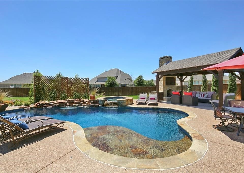 WELCOME TO THE BACKYARD OF YOUR DREAMS WITH A GORGEOUS SALT WATER DIVING POOL & SPA ON NEARLY .4 ACRES!
