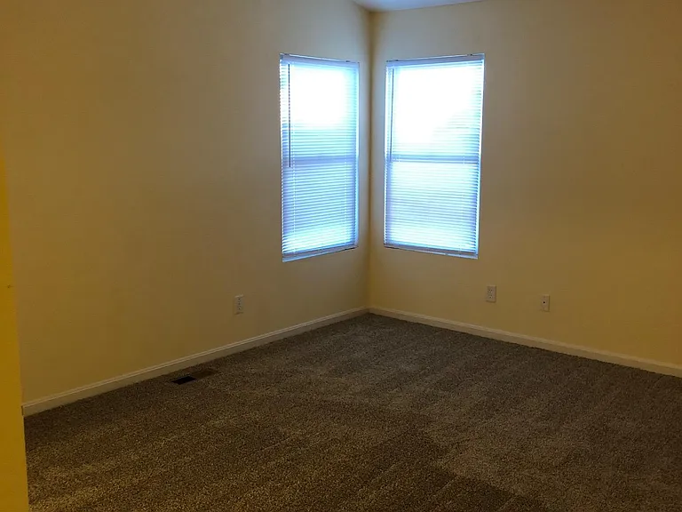 large master bedroom with vaulted ceiling