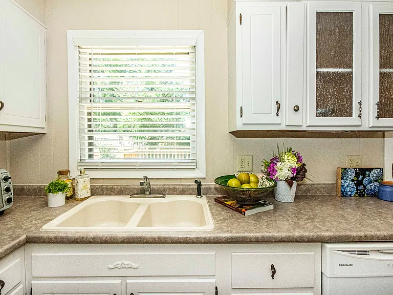 Dont you just love a kitchen window over the sink
Porcelain sink, too