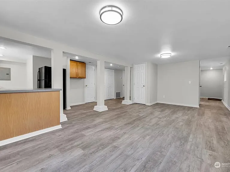 living room photo 1. Door at wall is a large storage closet