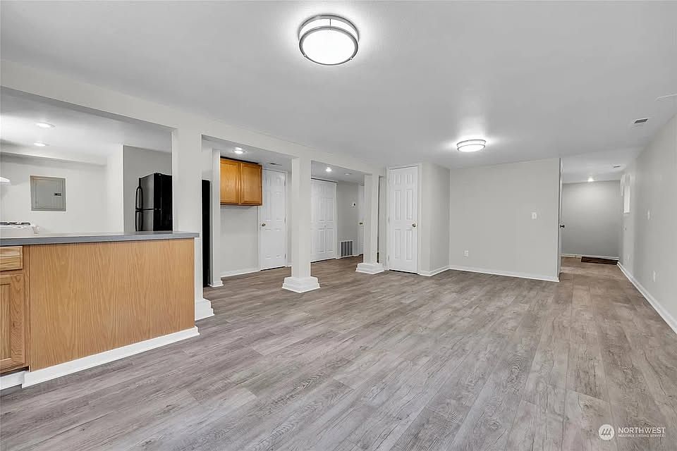 living room photo 1. Door at wall is a large storage closet