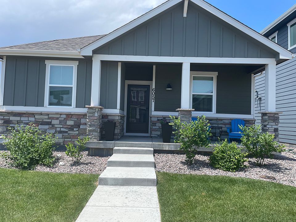 Front view of home with covered patio.