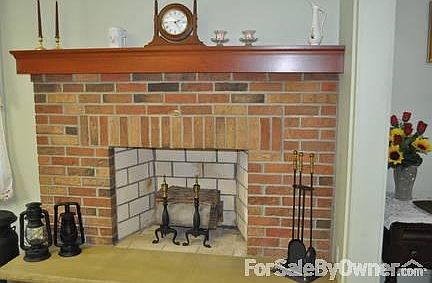 Brick fireplace in kitchen area