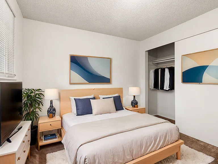 Experience relaxation in this beautifully designed bedroom, perfect for cozy living.
