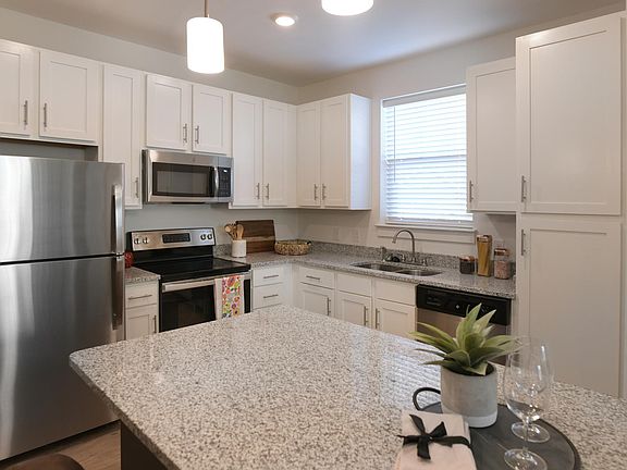 Gourmet Kitchen with Granite Countertops, White Shaker Cabinets & Stainless Steel Appliances
