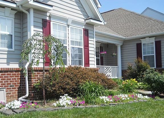 Beautiful Landscaping Surrounds This Home...