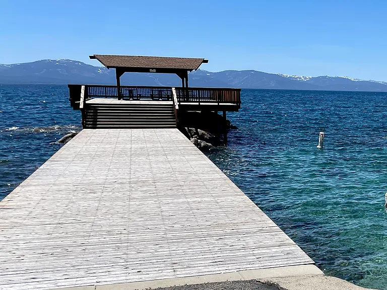 Large neighborhood pier with pavilion, plus swimming beach with stairway water entry and breakwater protection