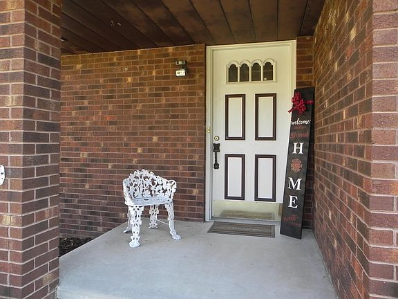 A covered porch opens..