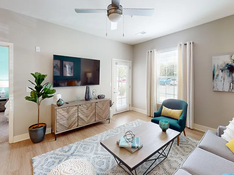 The spacious Conner living room leads to the private patio or balcony. The spacious Conner living room leads to the private patio or balcony.
