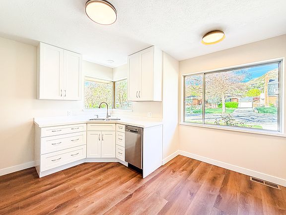 Kitchen + Dining Room - Brand new cabinets and appliances!