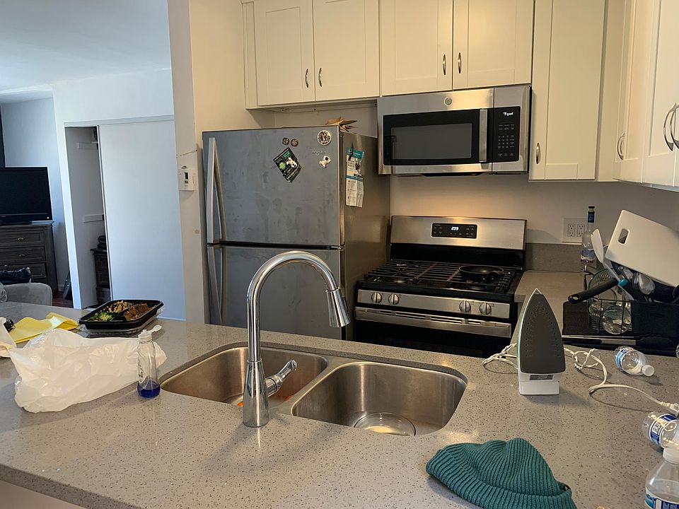 Completely renovated kitchen with stainless steel appliances, quartz countertops and ample storage