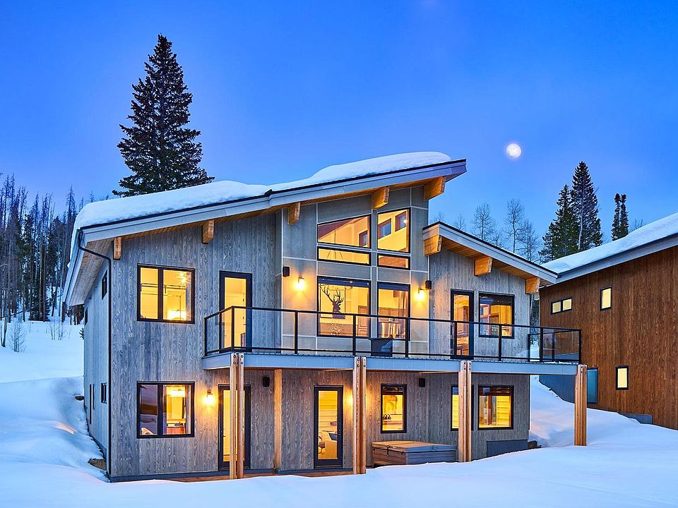 This gorgeous home features a generous two story deck covered patio with options for glass railings