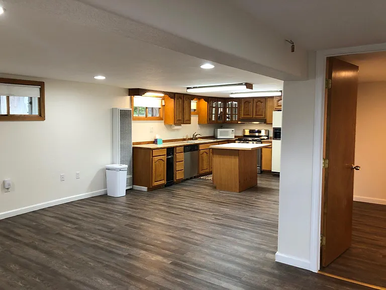 Large kitchen with door to one of the bedrooms