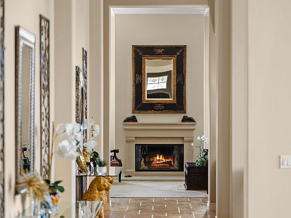 Elegant hallway with fireplace.