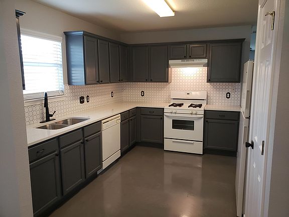 Polished concrete floors, quartz countertops, backsplash in kitchen Refrigerator and dishwasher included.