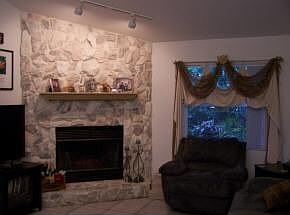 Family room with wood burning fireplace