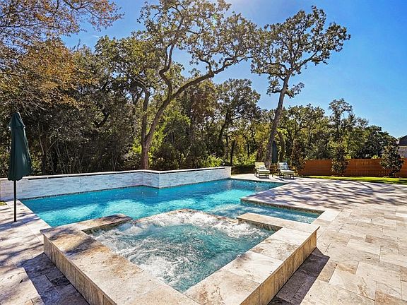 Custom heated swimming pool with spa.