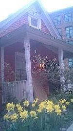 front of house with daffodils