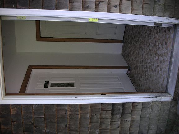 Mud room with coat closet and radiant heat tile floor