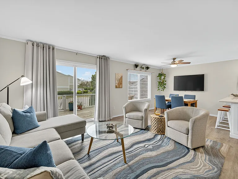 Fully furnished living room with dining table for 4.