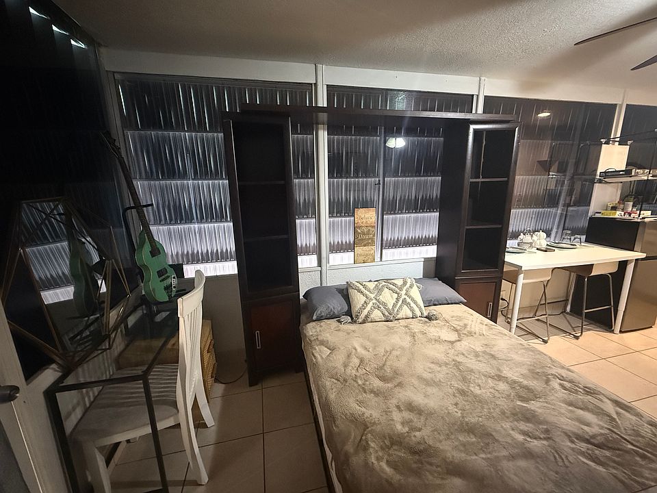 Full size bed with Apple storage and a desk