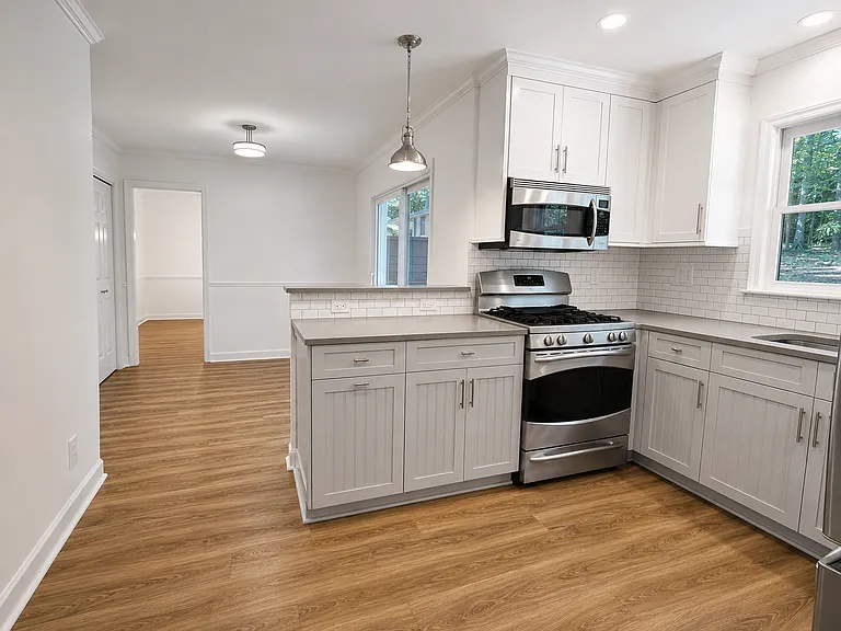 Kitchen with eating nook leading through to the dining room