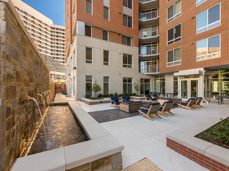 Courtyard with Outdoor Fireplaces, Landscaping, and Elegant Water Feature
