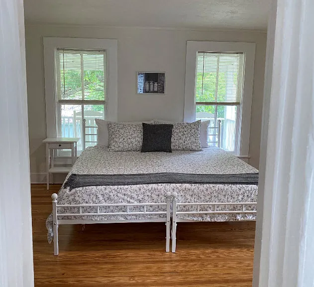 Upstairs east bedroom with king bed configuration.