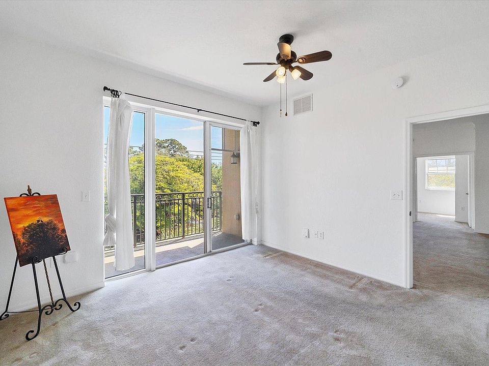 Master Bedroom w Sliders to Balcony