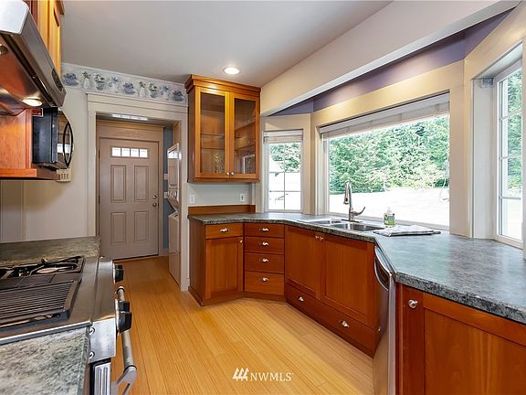 kitchen remodeled with cherry cabinets and Stainless steel appliances