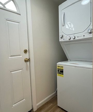 Laundry room with door to outside balcony