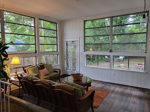 Two walls of windows- I love this room- so much natural light and privacy all at once